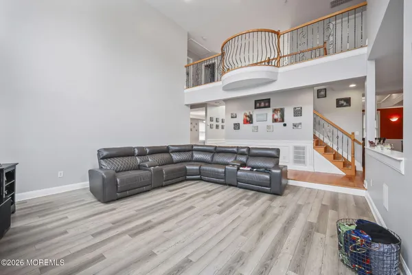a bedroom with a bed dresser and a flat screen tv