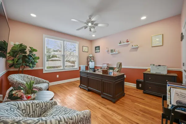 a bathroom with a toilet a sink and a mirror