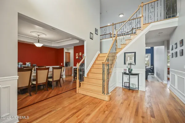 a large kitchen with kitchen island a sink a counter top space stainless steel appliances and a window