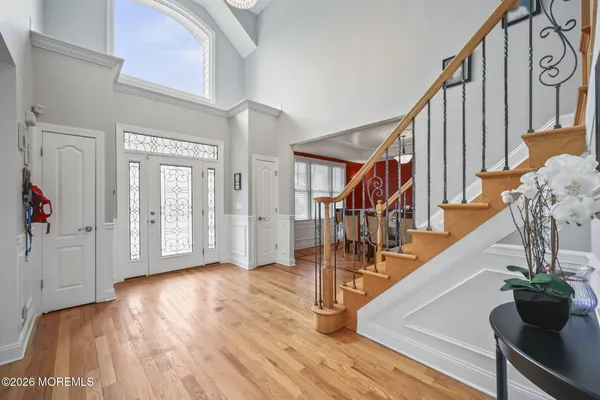 a kitchen with kitchen island granite countertop a sink a counter space appliances and cabinets