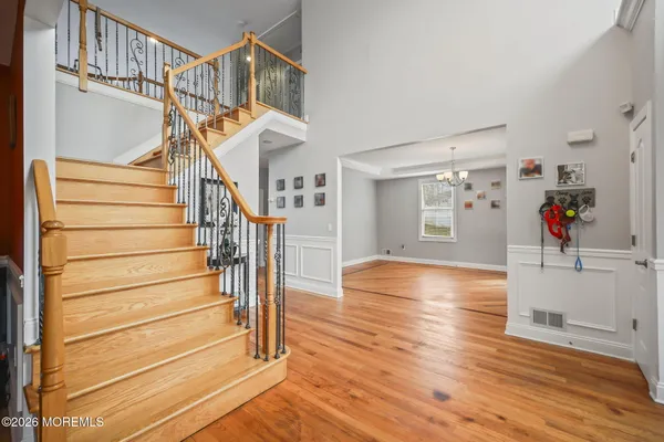 a living room with furniture and a book shelf