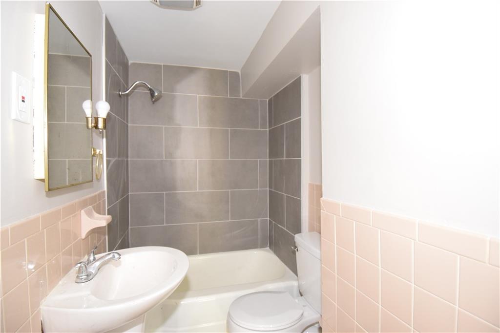 420 Jefferson Street Rochester, PA 15074 - Photo 11 of 19 a bathroom with a sink toilet and shower