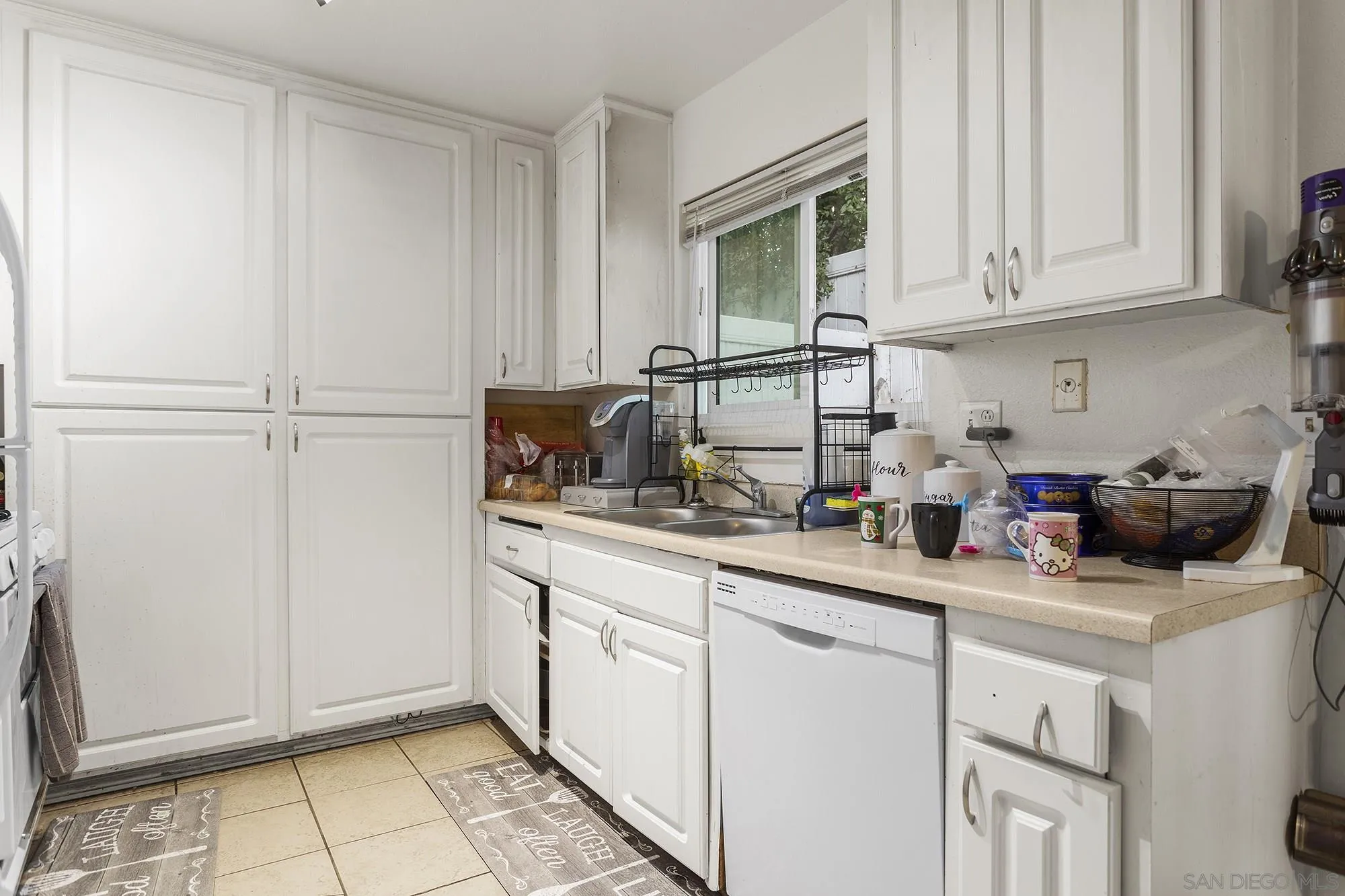 9041 Rosedale Drive, Unit A/B Spring Valley, CA 91977 - Photo 11 of 37 a kitchen with stainless steel appliances granite countertop a sink stove and cabinets
