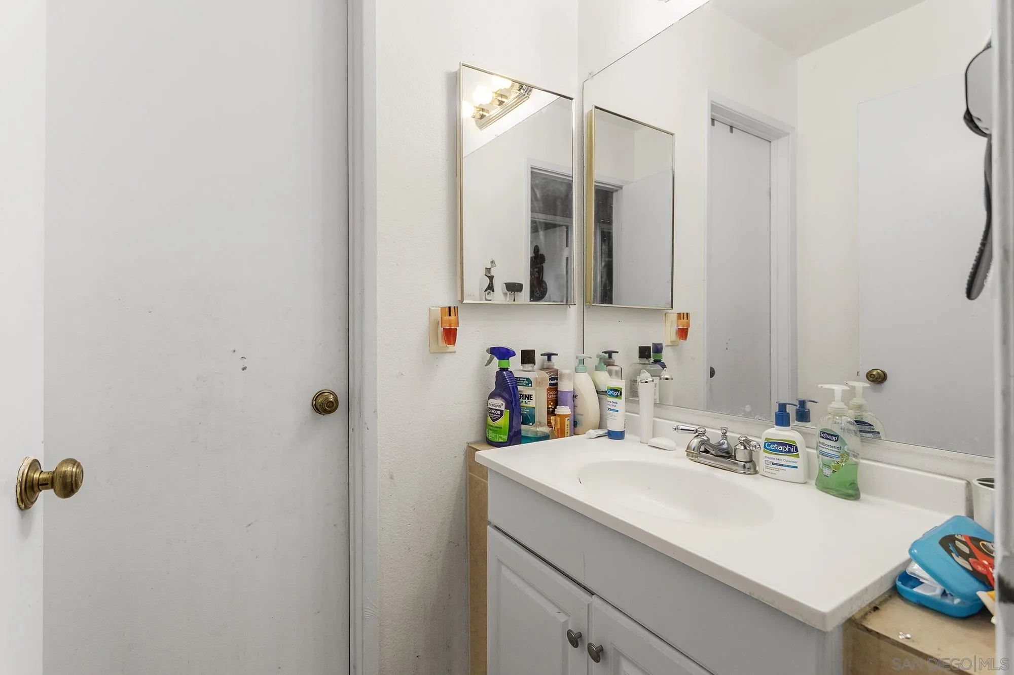 9041 Rosedale Drive, Unit A/B Spring Valley, CA 91977 - Photo 15 of 37 a bathroom with a sink and a mirror