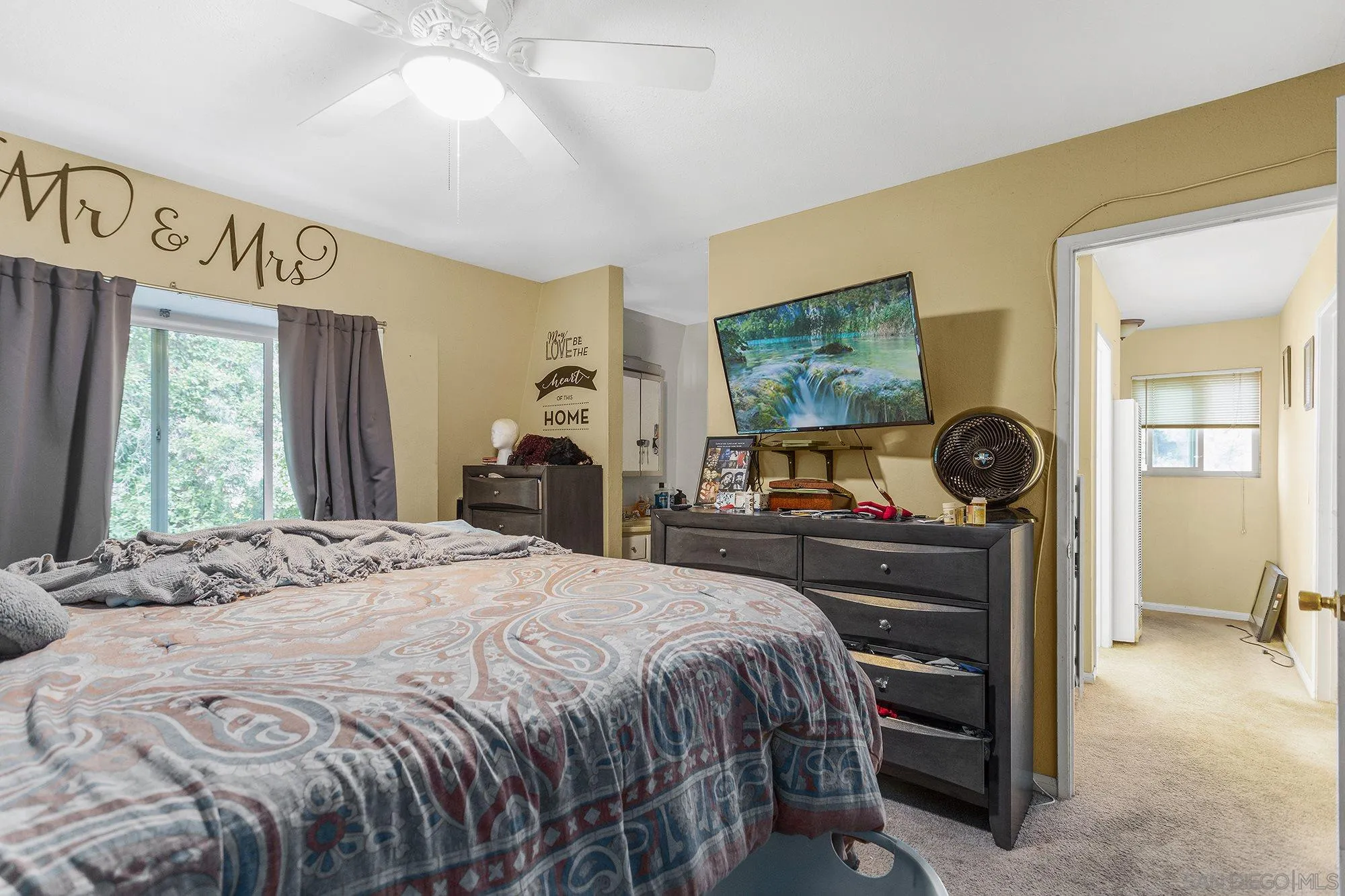 9041 Rosedale Drive, Unit A/B Spring Valley, CA 91977 - Photo 17 of 37 a bedroom with a bed and a window
