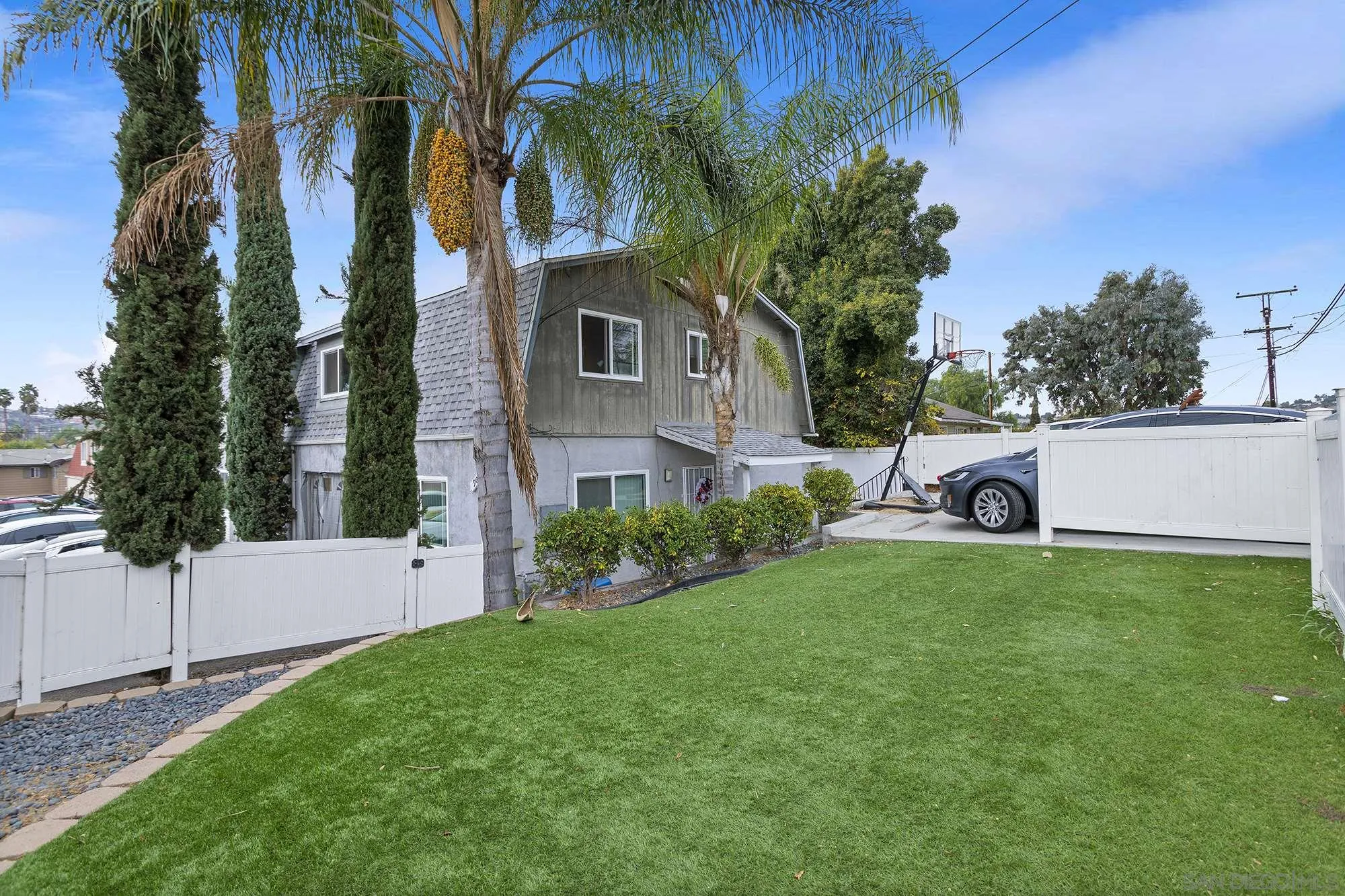 9041 Rosedale Drive, Unit A/B Spring Valley, CA 91977 - Photo 20 of 37 a front view of a house with garden
