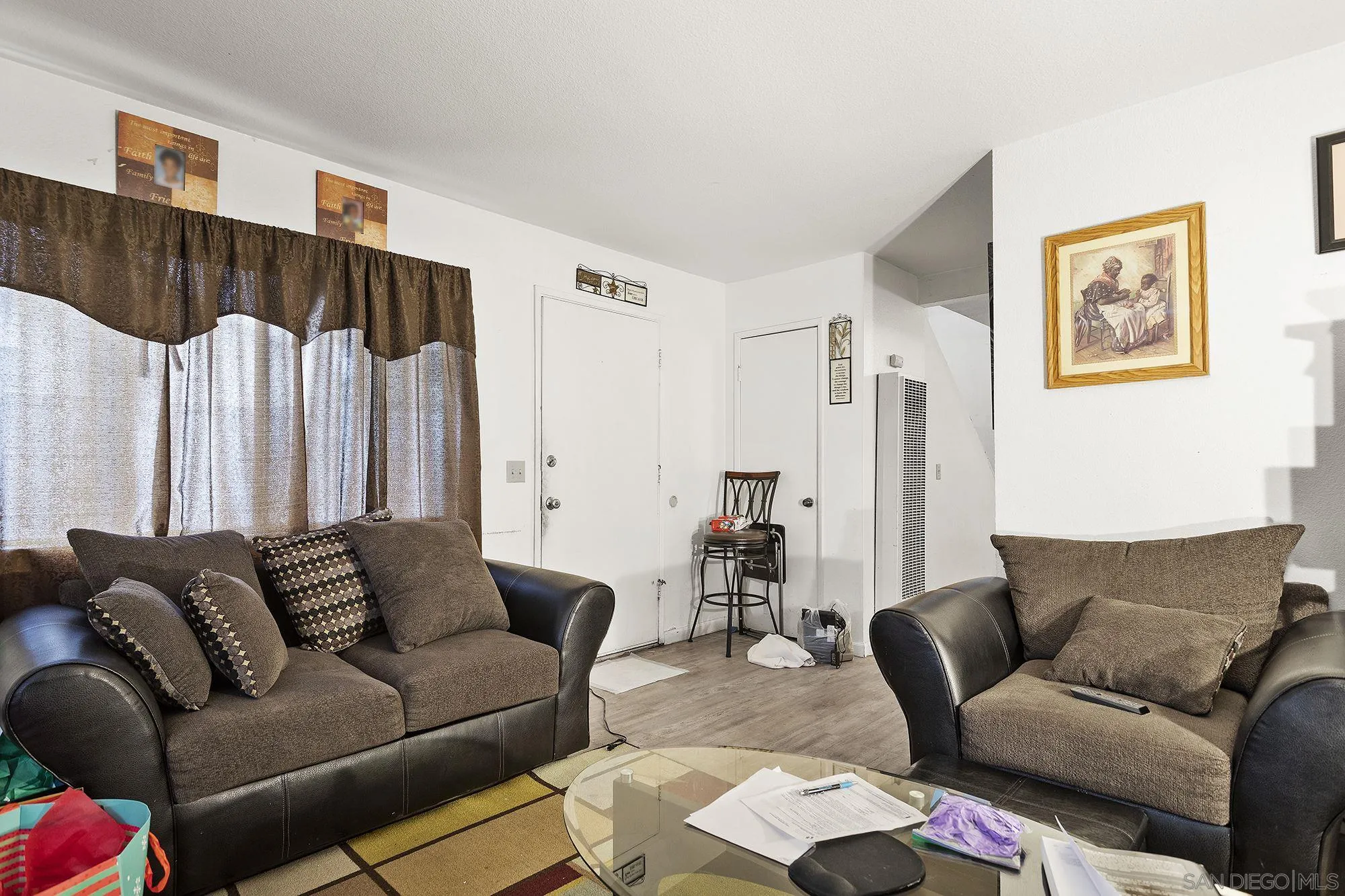9041 Rosedale Drive, Unit A/B Spring Valley, CA 91977 - Photo 24 of 37 a living room with furniture and a couch