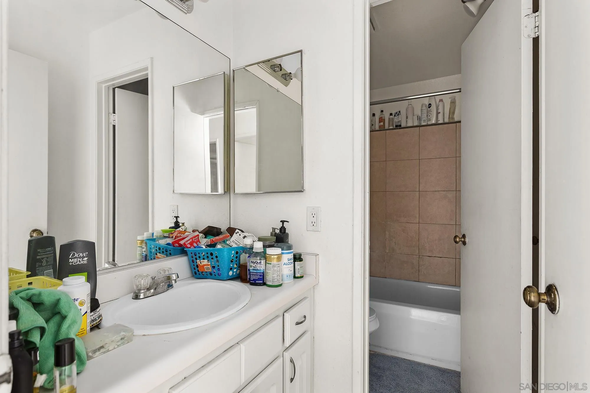 9041 Rosedale Drive, Unit A/B Spring Valley, CA 91977 - Photo 34 of 37 a bathroom with a sink vanity granite tub and shower