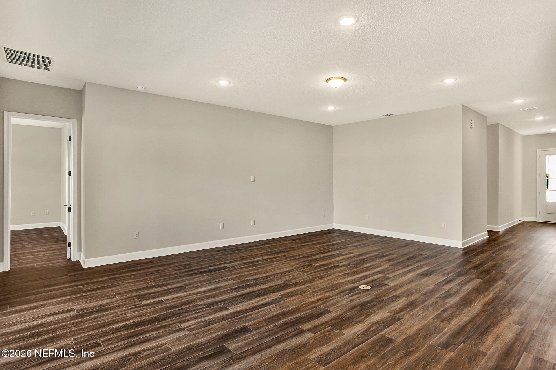 59 Ribera Drive Flagler Beach, FL 32136 - Photo 11 of 16 a view of room with wooden floor and white walls