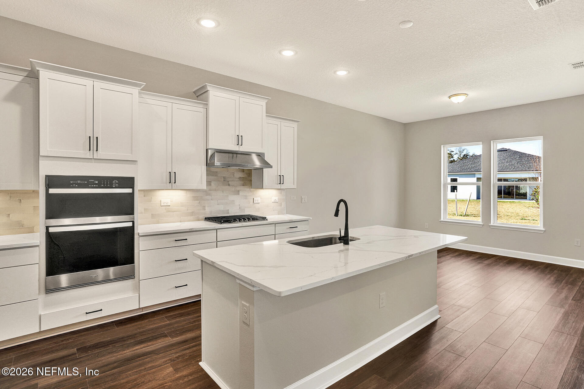 59 Ribera Drive Flagler Beach, FL 32136 - Photo 13 of 16 a kitchen with a stove a sink and a refrigerator
