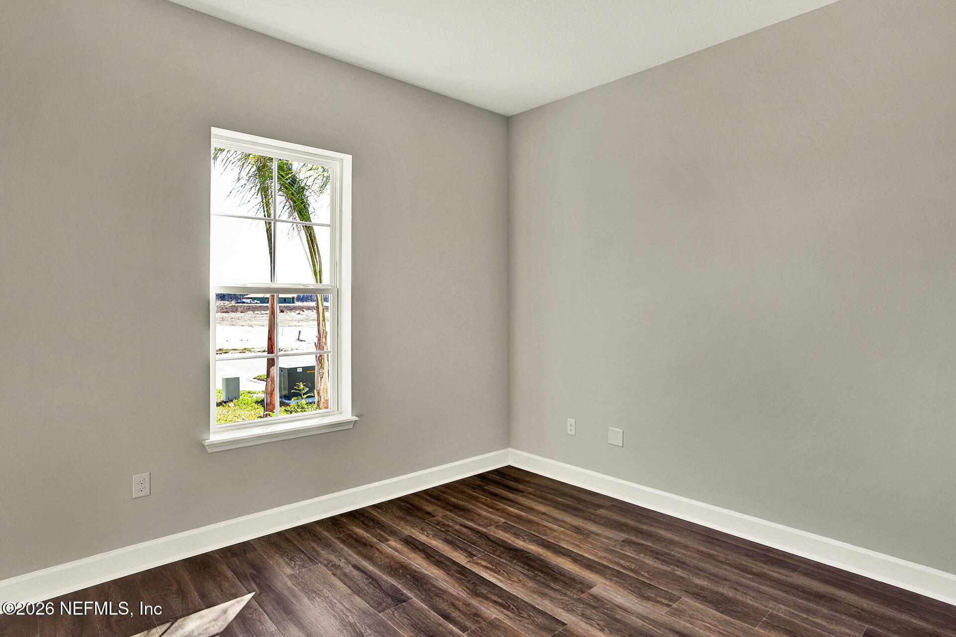 59 Ribera Drive Flagler Beach, FL 32136 - Photo 4 of 16 a view of an empty room with wooden floor and a window