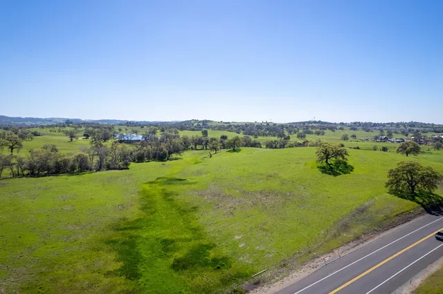 a view of a field with an ocean