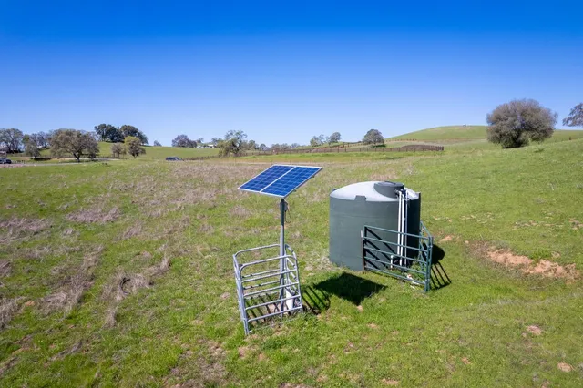 a view of a lake with a yard