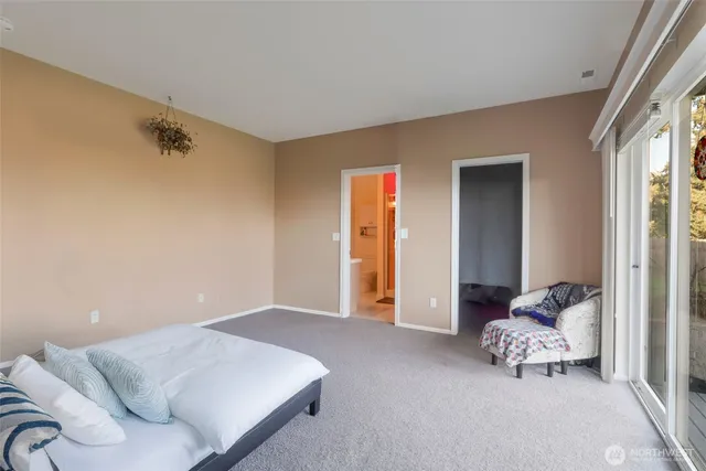 a bedroom with furniture and a window