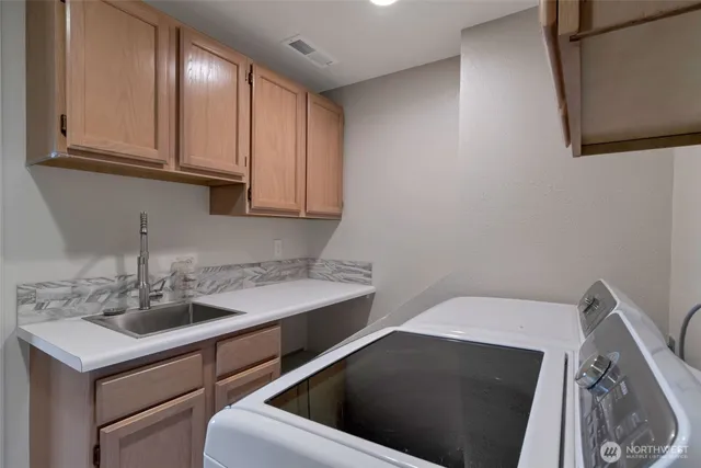 a living room with furniture floor to ceiling window and a floor to ceiling window
