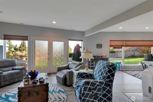 a kitchen with stainless steel appliances a stove a sink a microwave and cabinets