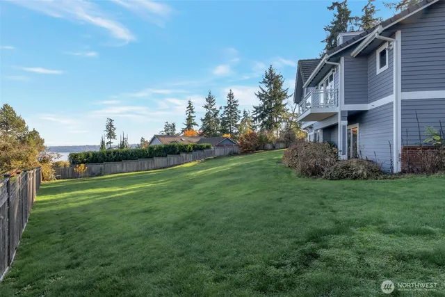 a view of a chairs and table in the balcony