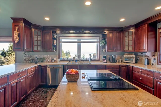 a kitchen with a sink and wooden cabinets