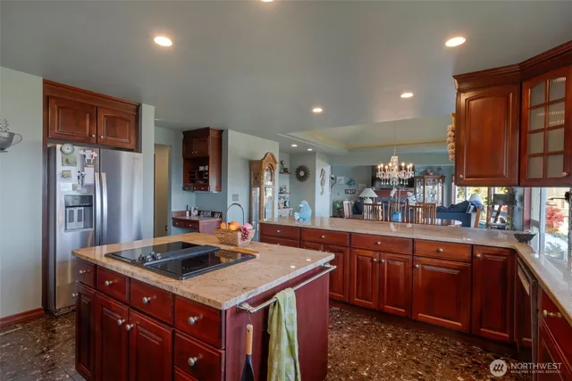 a kitchen with a sink stove and cabinets