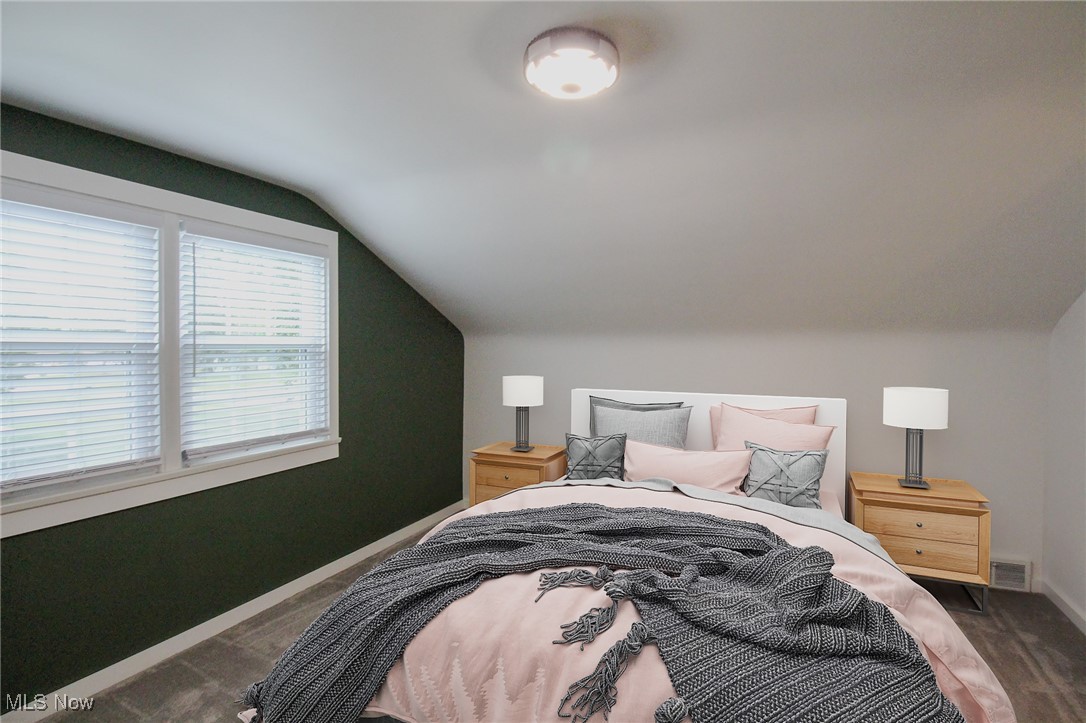207 Harmon Road Aurora, OH 44202 - Photo 25 of 40 Bedroom #3 - Virtually staged featuring a queen sized bed, neutral carpet and 2 windows.