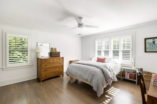 a bed room with a bed and a window