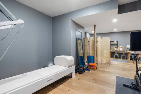 a bedroom with furniture and a chandelier