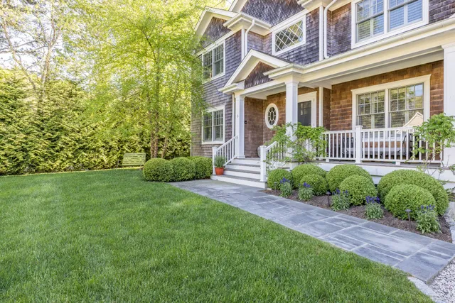 front view of a house with a yard