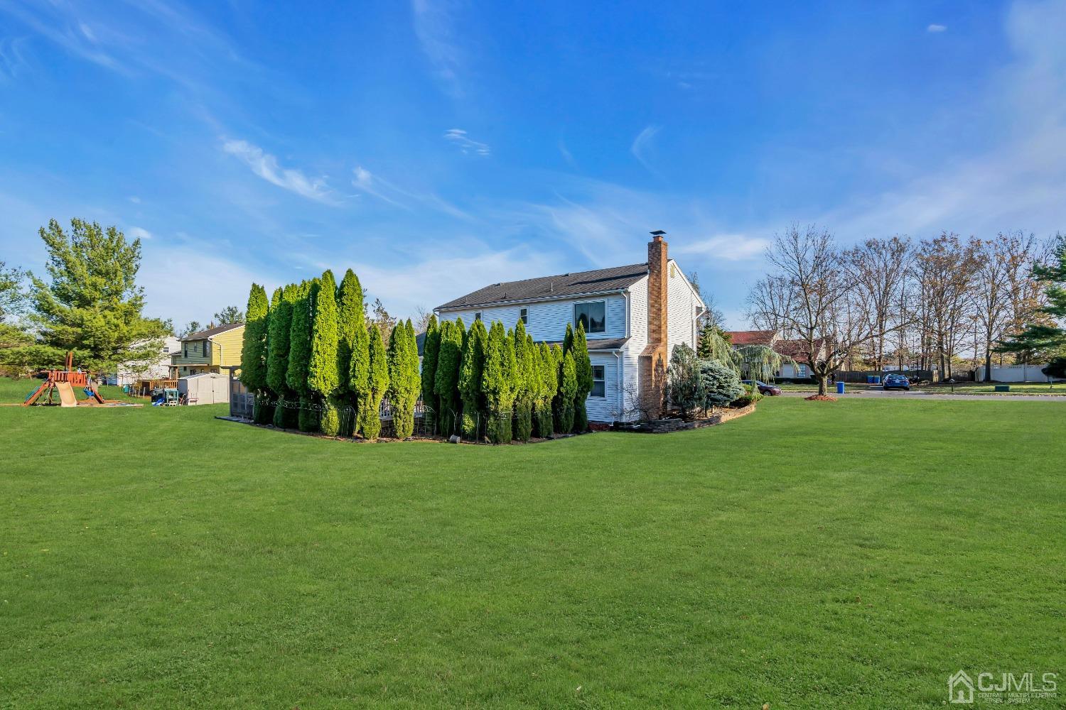116 Hickory Road Somerset, NJ 08873 - Photo 54 of 54 a front view of a house with garden