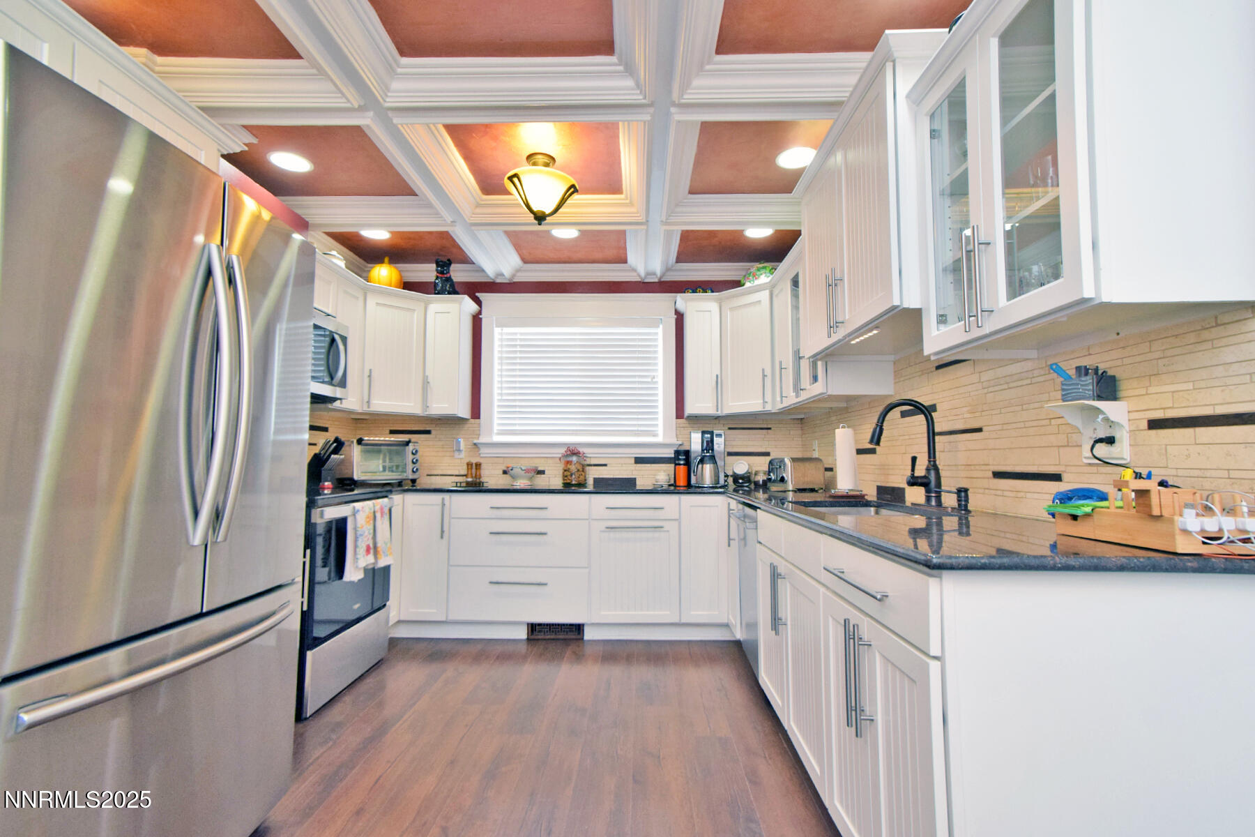 3050 Attridge Place Reno, NV 89503 - Photo 11 of 62 a kitchen with stainless steel appliances granite countertop a sink and a refrigerator