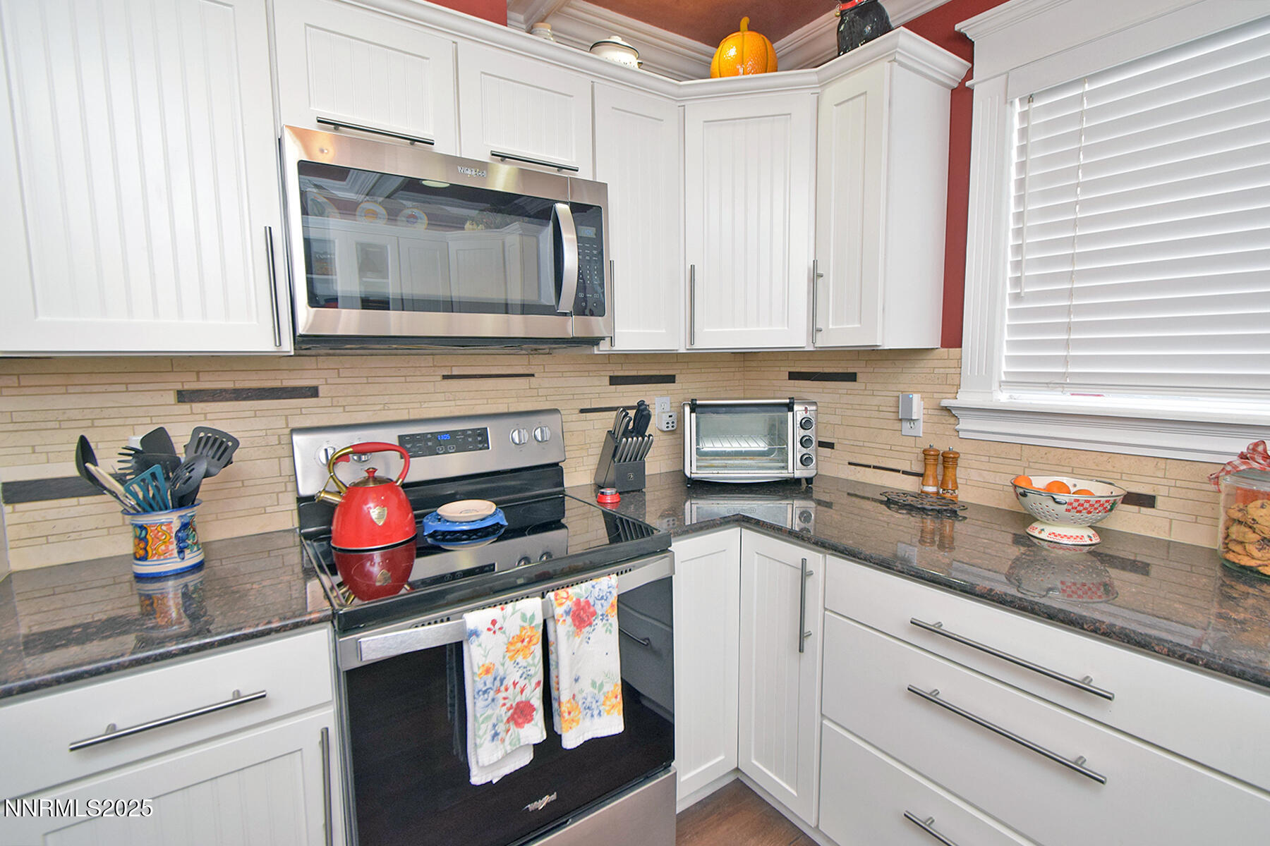 3050 Attridge Place Reno, NV 89503 - Photo 14 of 62 a kitchen with granite countertop a sink stainless steel appliances and cabinets