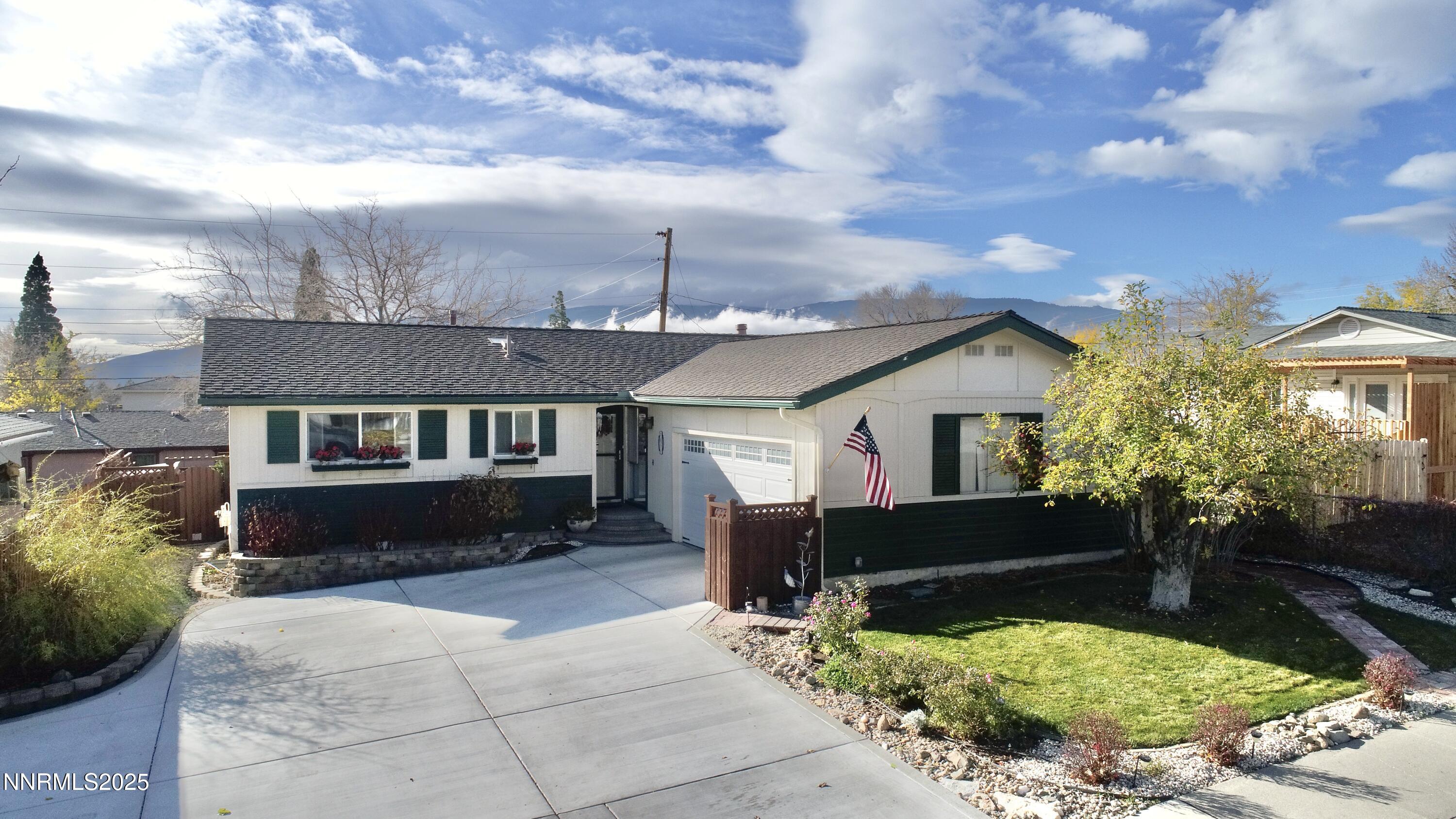 3050 Attridge Place Reno, NV 89503 - Photo 2 of 62 a front view of a house with a yard