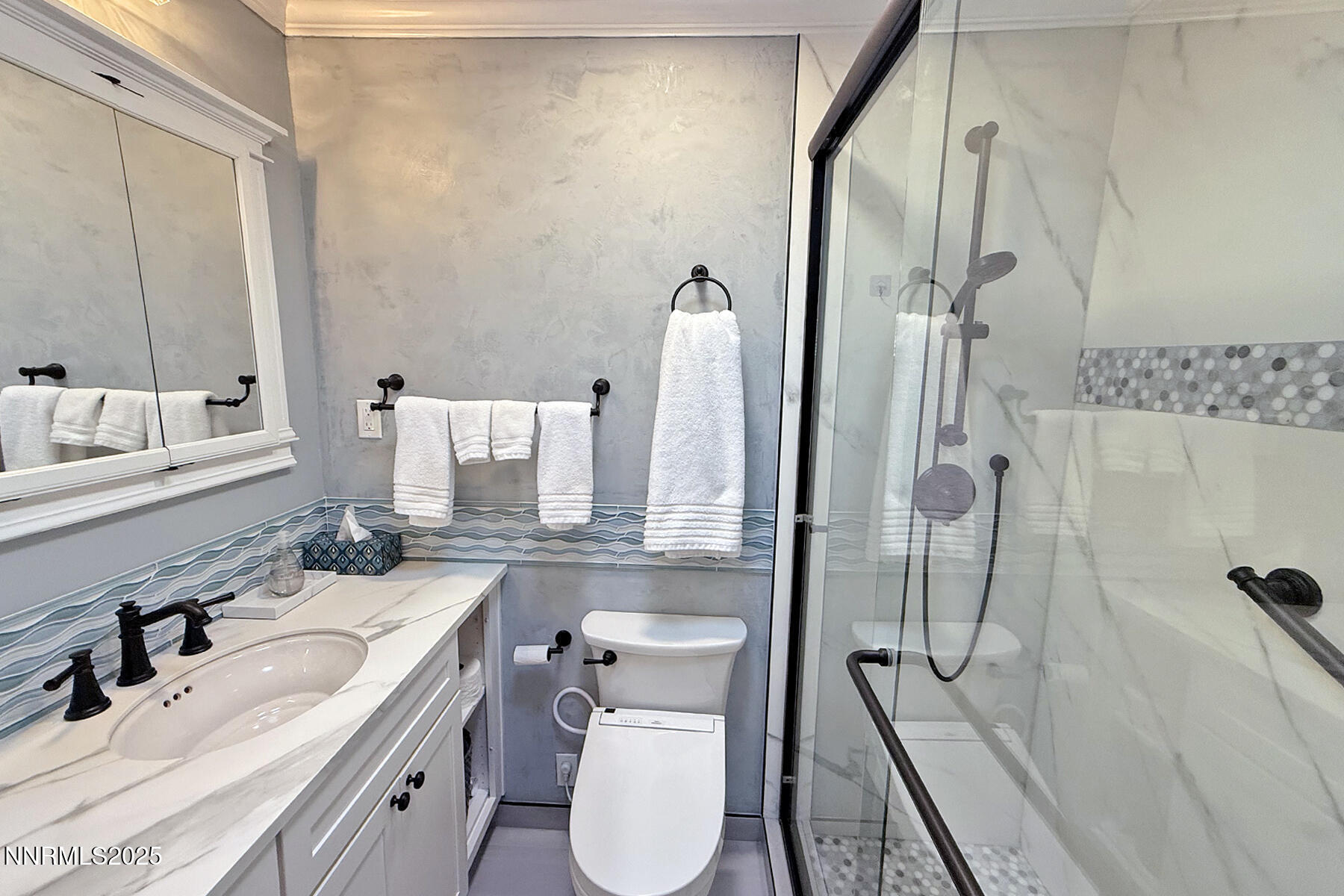 3050 Attridge Place Reno, NV 89503 - Photo 23 of 62 a bathroom with a sink toilet and shower