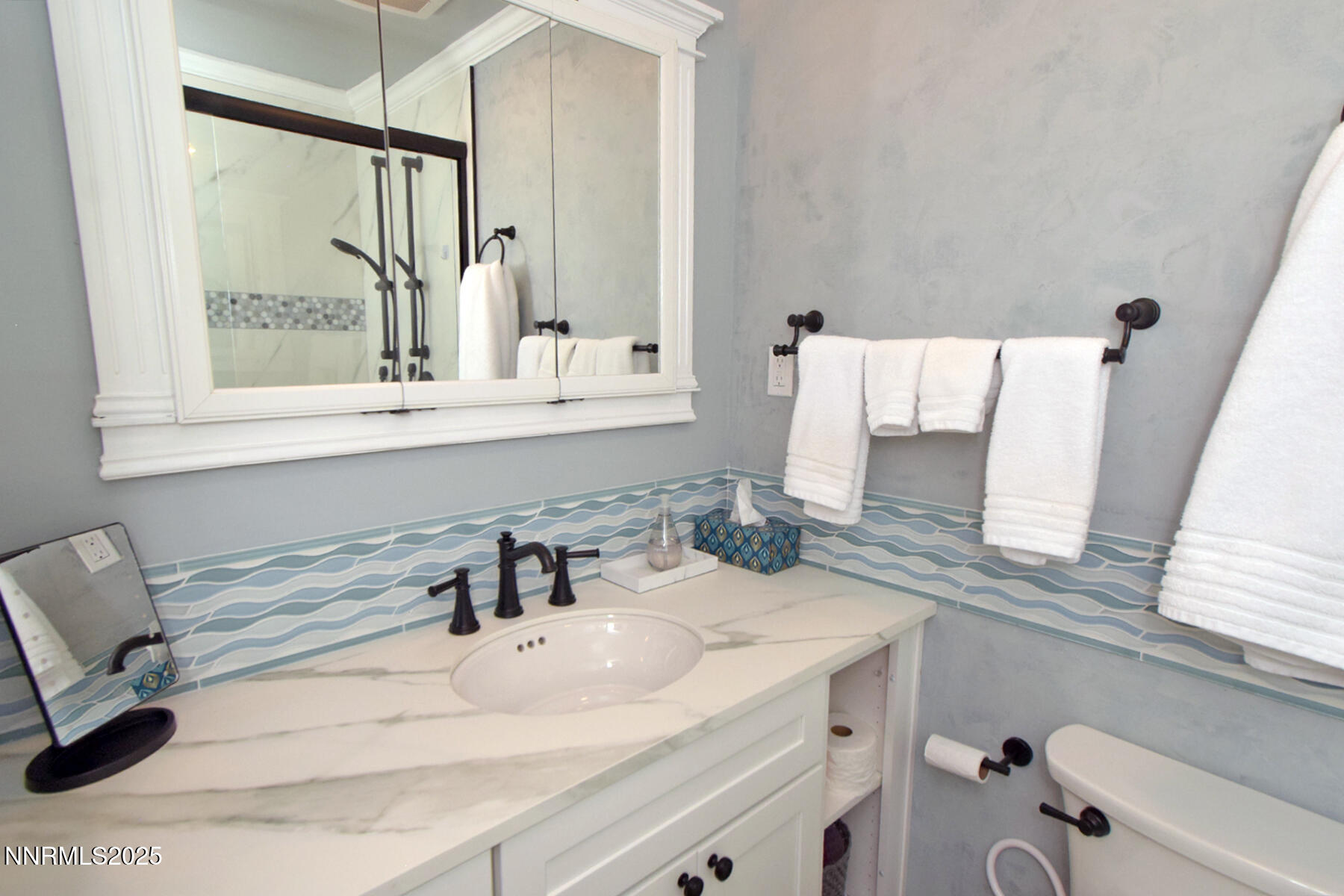 3050 Attridge Place Reno, NV 89503 - Photo 25 of 62 a bathroom with a sink and a mirror