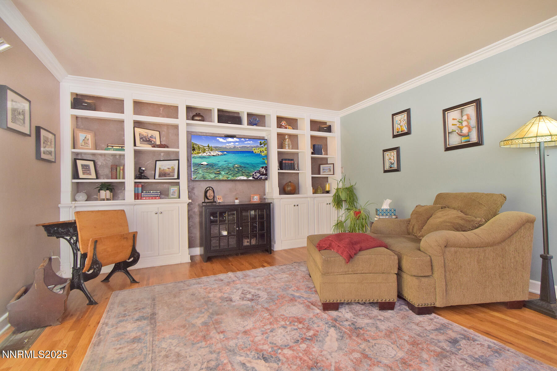 3050 Attridge Place Reno, NV 89503 - Photo 28 of 62 a living room with furniture and a bookshelf