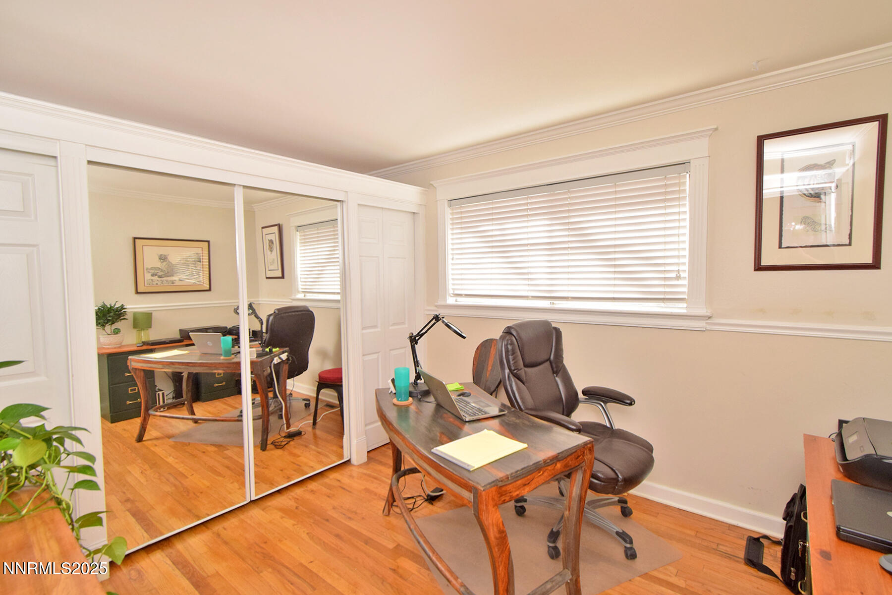 3050 Attridge Place Reno, NV 89503 - Photo 34 of 62 a living room with furniture a desk and chair with wooden floor