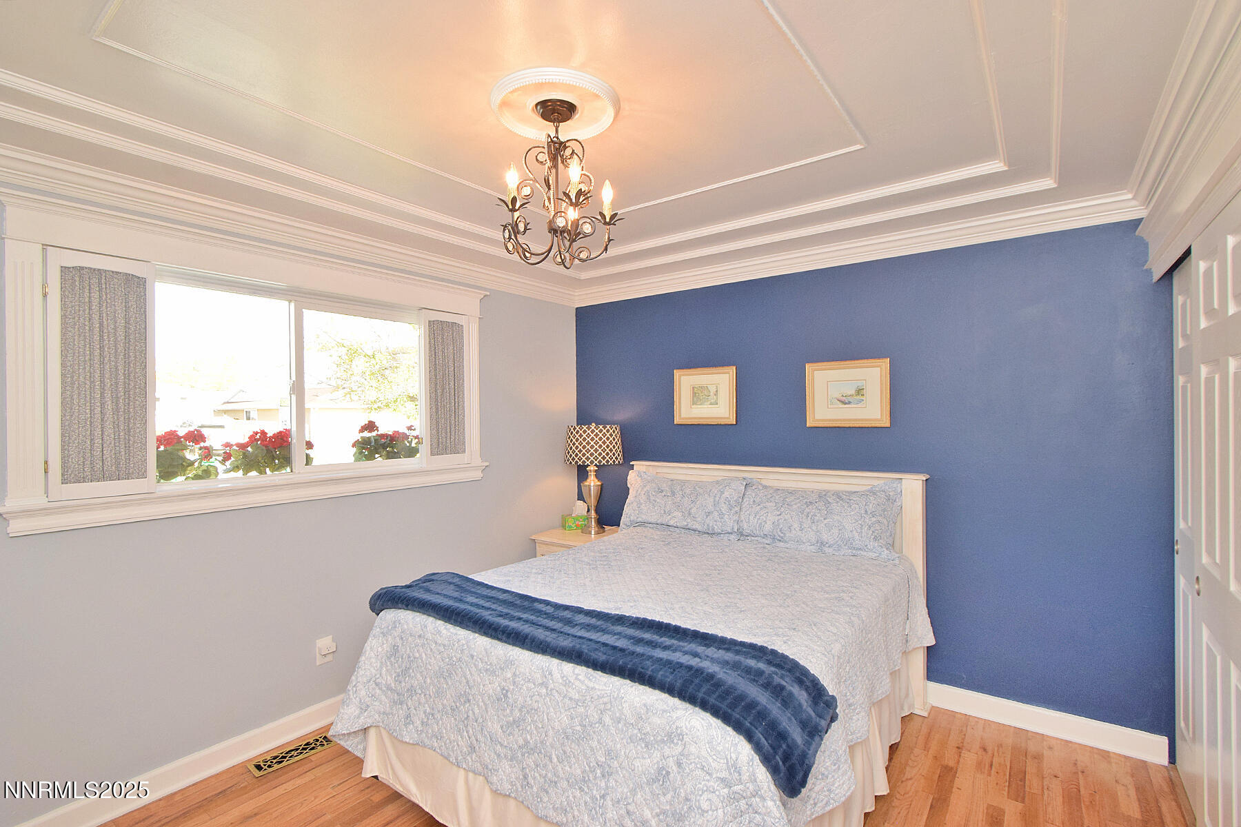 3050 Attridge Place Reno, NV 89503 - Photo 37 of 62 a bedroom with a bed and a chandelier