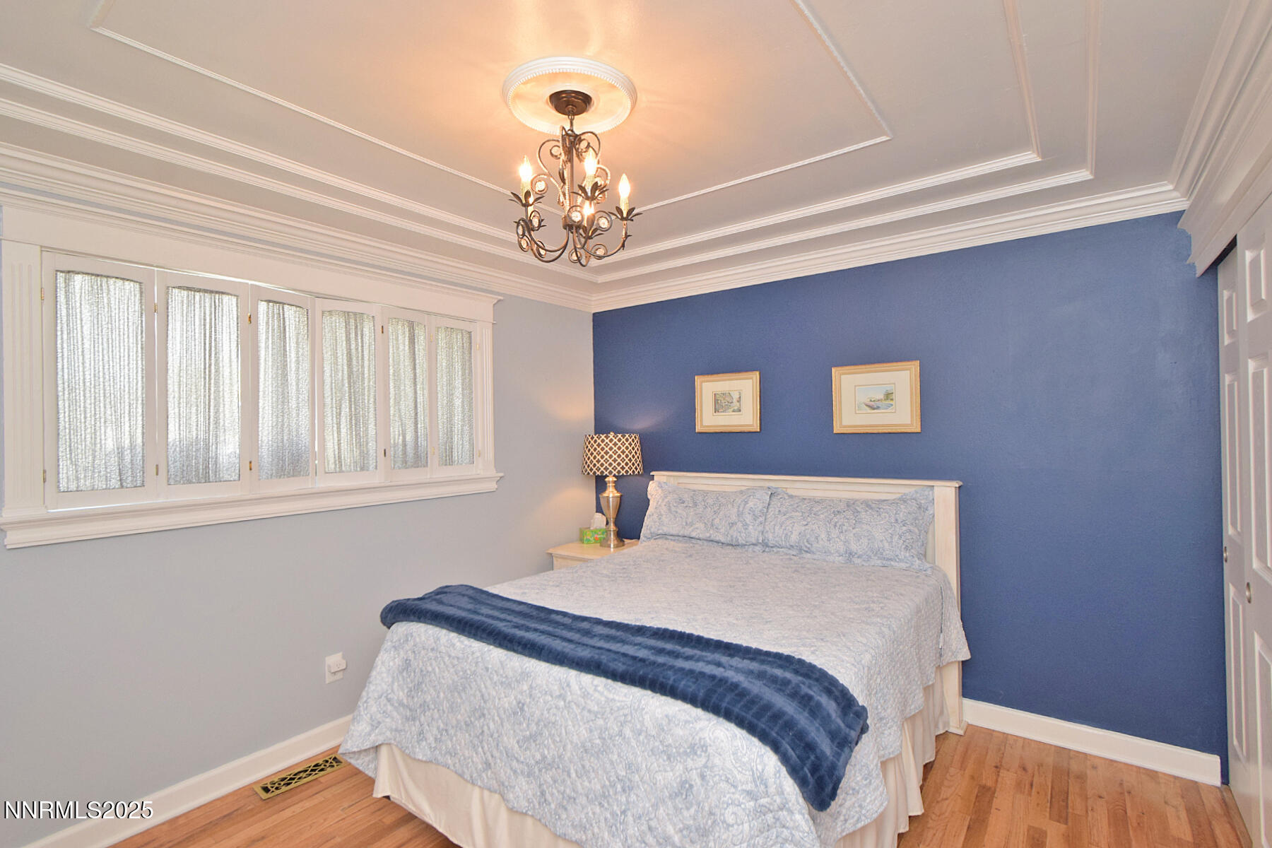 3050 Attridge Place Reno, NV 89503 - Photo 38 of 62 a bedroom with a bed and a chandelier