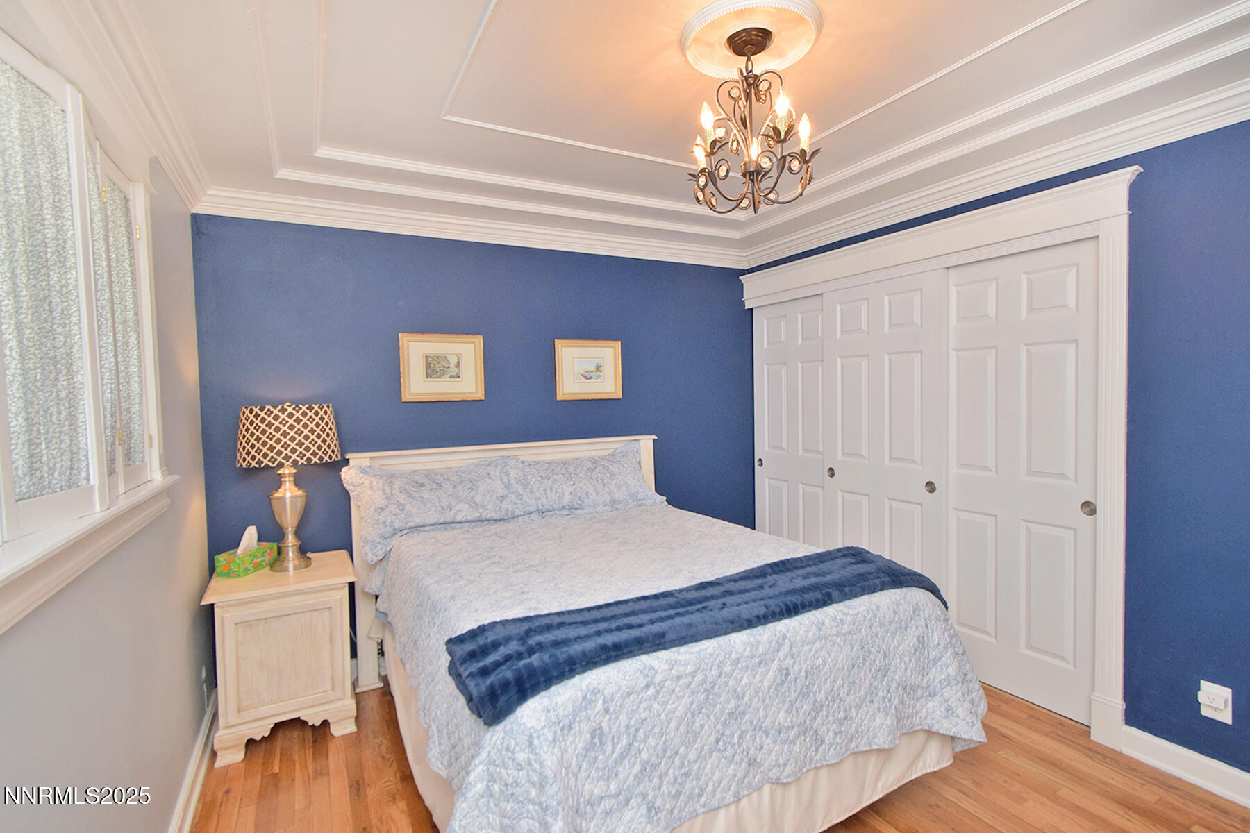 3050 Attridge Place Reno, NV 89503 - Photo 39 of 62 a bedroom with a bed and a chandelier