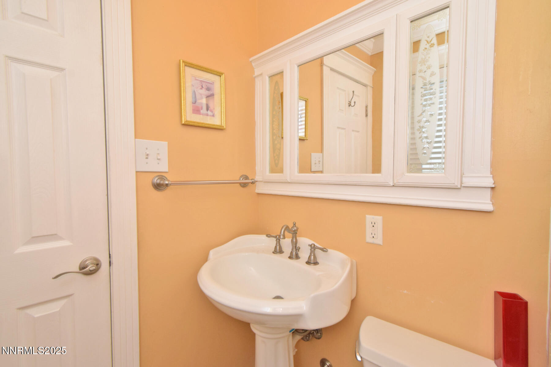 3050 Attridge Place Reno, NV 89503 - Photo 44 of 62 a bathroom with a sink and a mirror