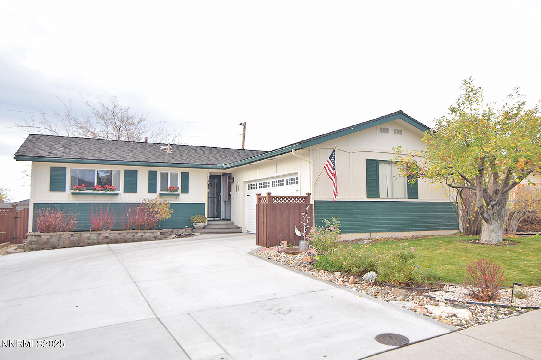 3050 Attridge Place Reno, NV 89503 - Photo 59 of 62 a front view of a house with a yard and garage