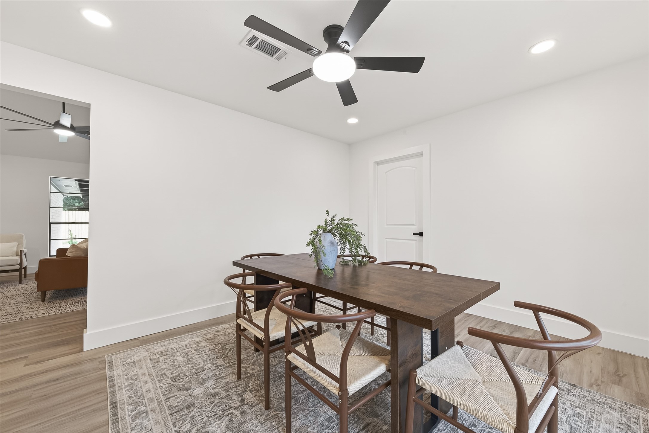 29514 Loddington Street Spring, TX 77386 - Photo 18 of 38 a view of a dining room with furniture and wooden floor