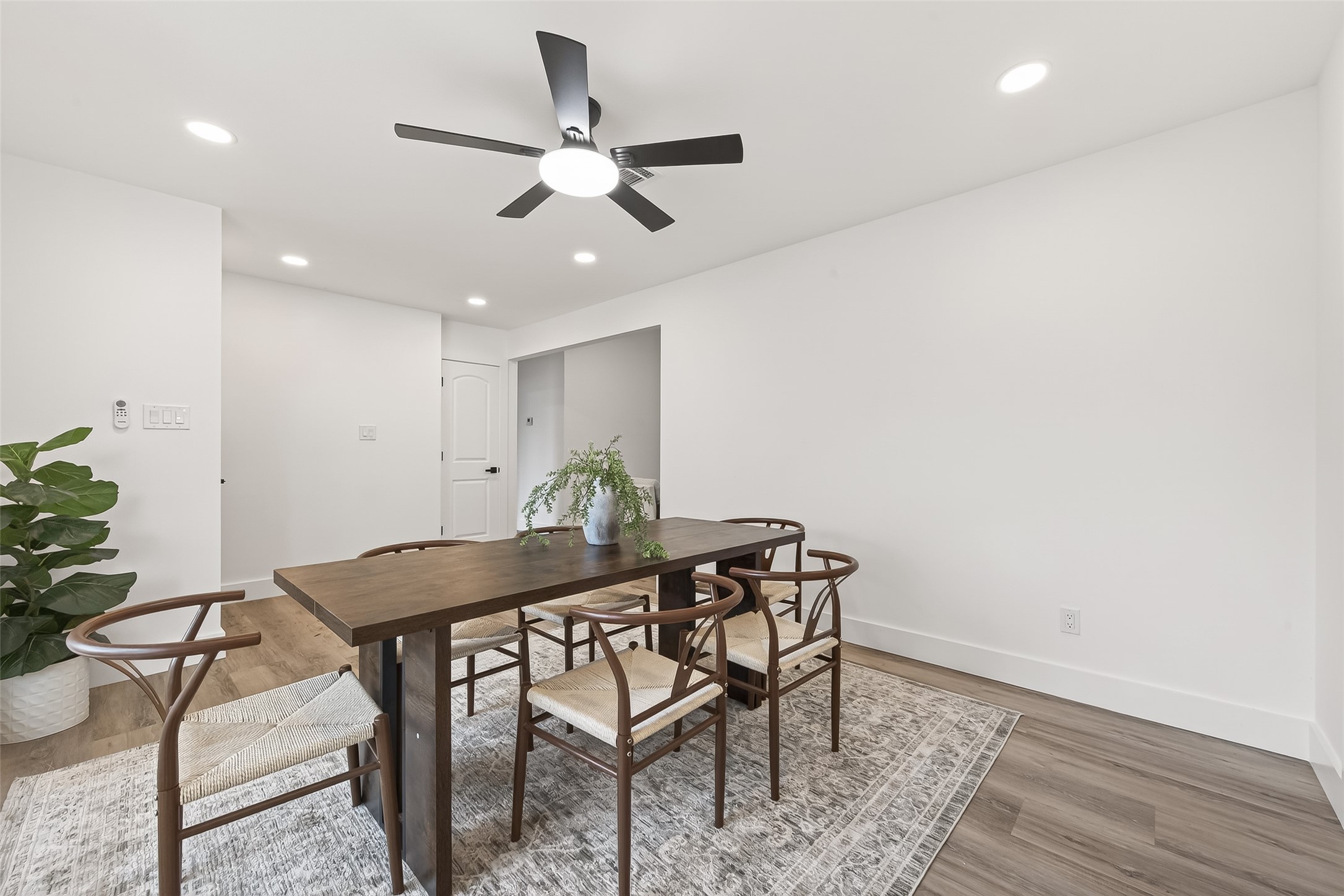 29514 Loddington Street Spring, TX 77386 - Photo 19 of 38 a view of a dining room with furniture and wooden floor
