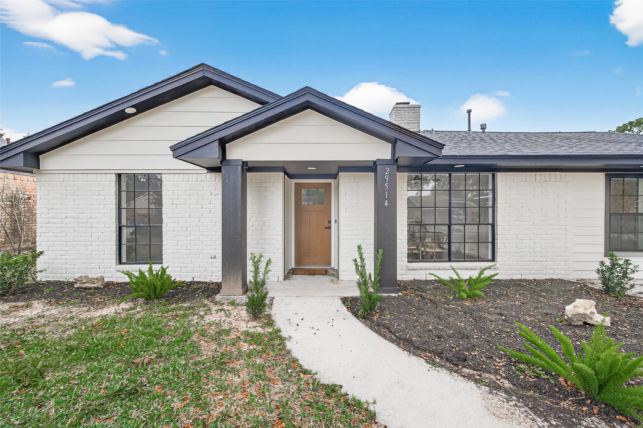 29514 Loddington Street Spring, TX 77386 - Photo 2 of 38 a front view of a house with garden