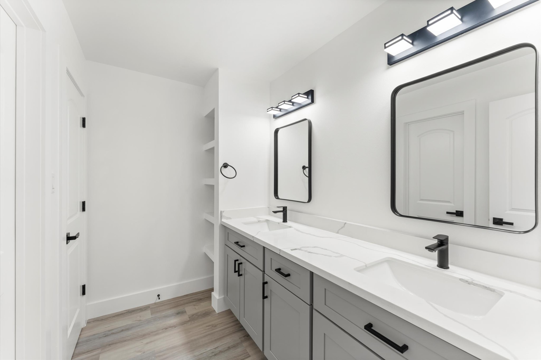 29514 Loddington Street Spring, TX 77386 - Photo 28 of 38 a bathroom with a double vanity sink and mirror