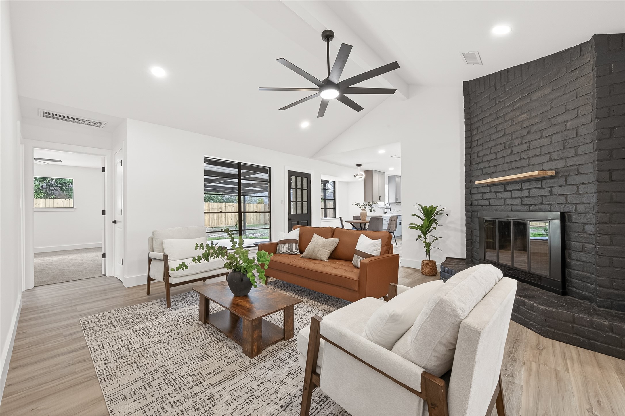 29514 Loddington Street Spring, TX 77386 - Photo 6 of 38 a living room with furniture and a fireplace