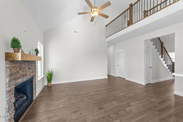 a kitchen with stainless steel appliances granite countertop a sink a stove and cabinets