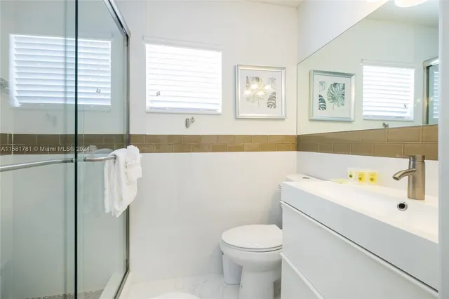 a bathroom with a sink a toilet and a bathtub