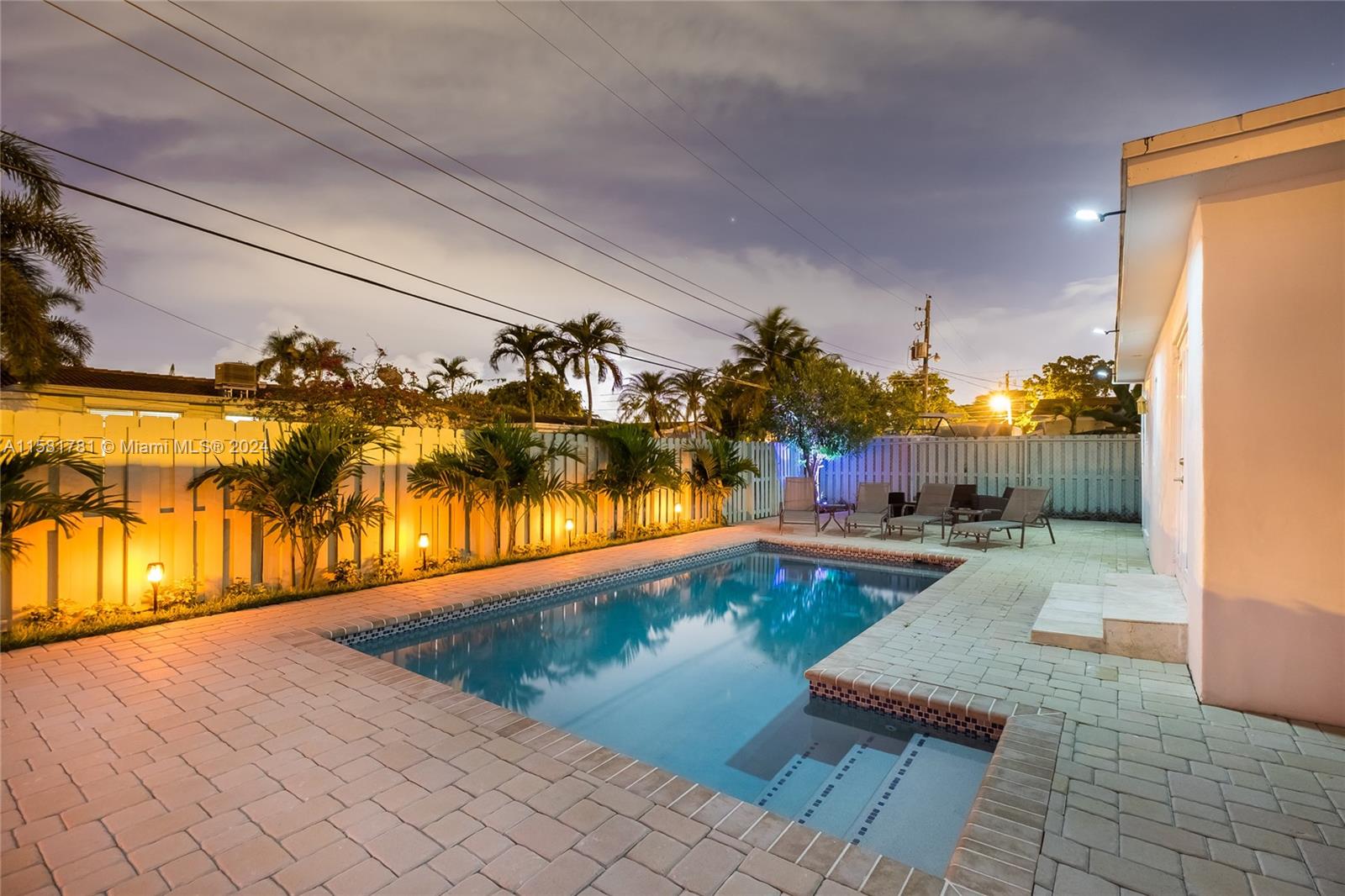 210 Southeast 4th Street Dania Beach, FL 33004 - Photo 16 of 16 a view of a swimming pool and lounge chair