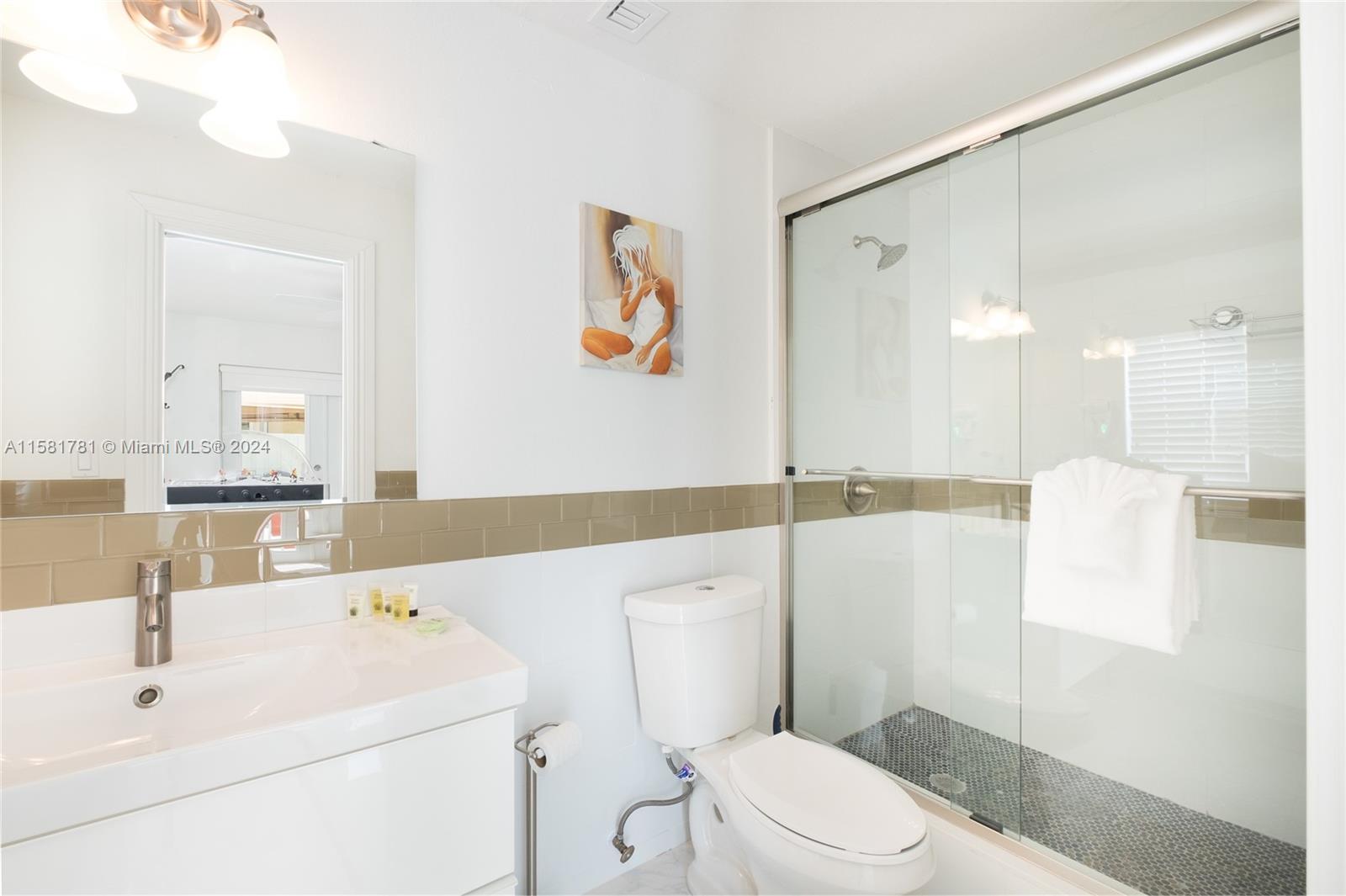 210 Southeast 4th Street Dania Beach, FL 33004 - Photo 6 of 16 a bathroom with a sink a toilet and shower