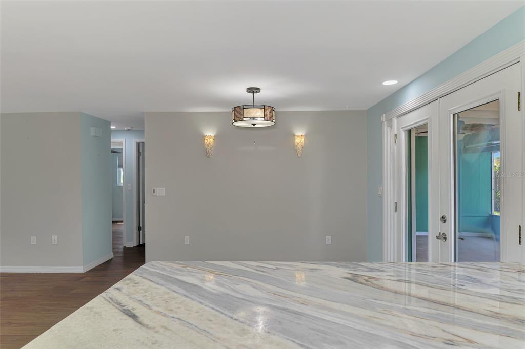 2490 Eleventh Street Englewood, FL 34224 - Photo 13 of 49 a view of a livingroom with wooden floor and window